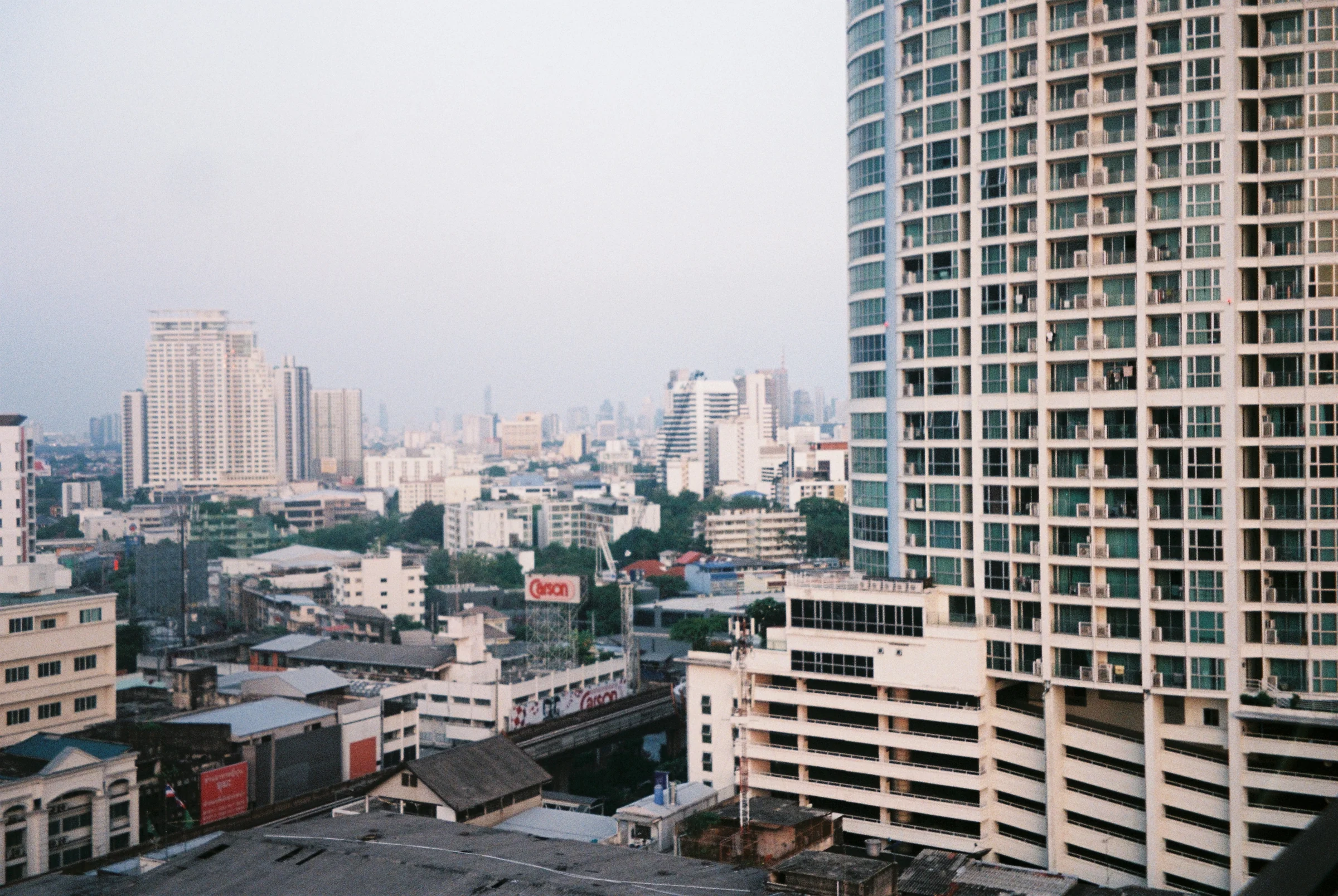 Bangkok skyline and high-rise buildings photographed on film in Thailand.